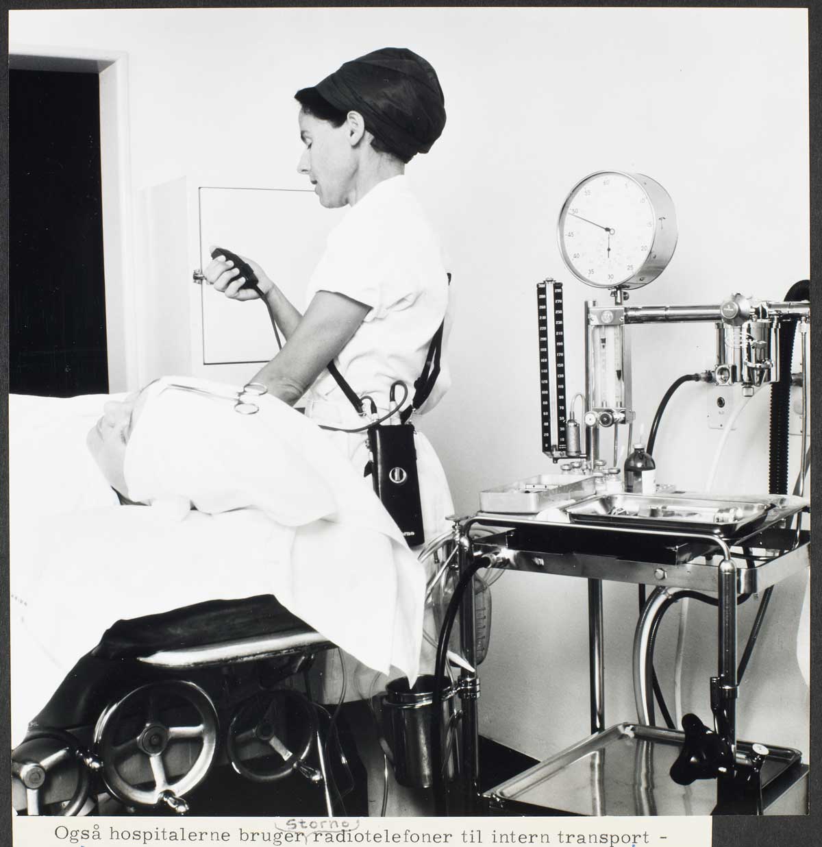 Nurse in hospital using Storno mobile radio telephone