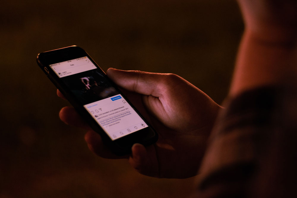 Person staring at iPhone screen