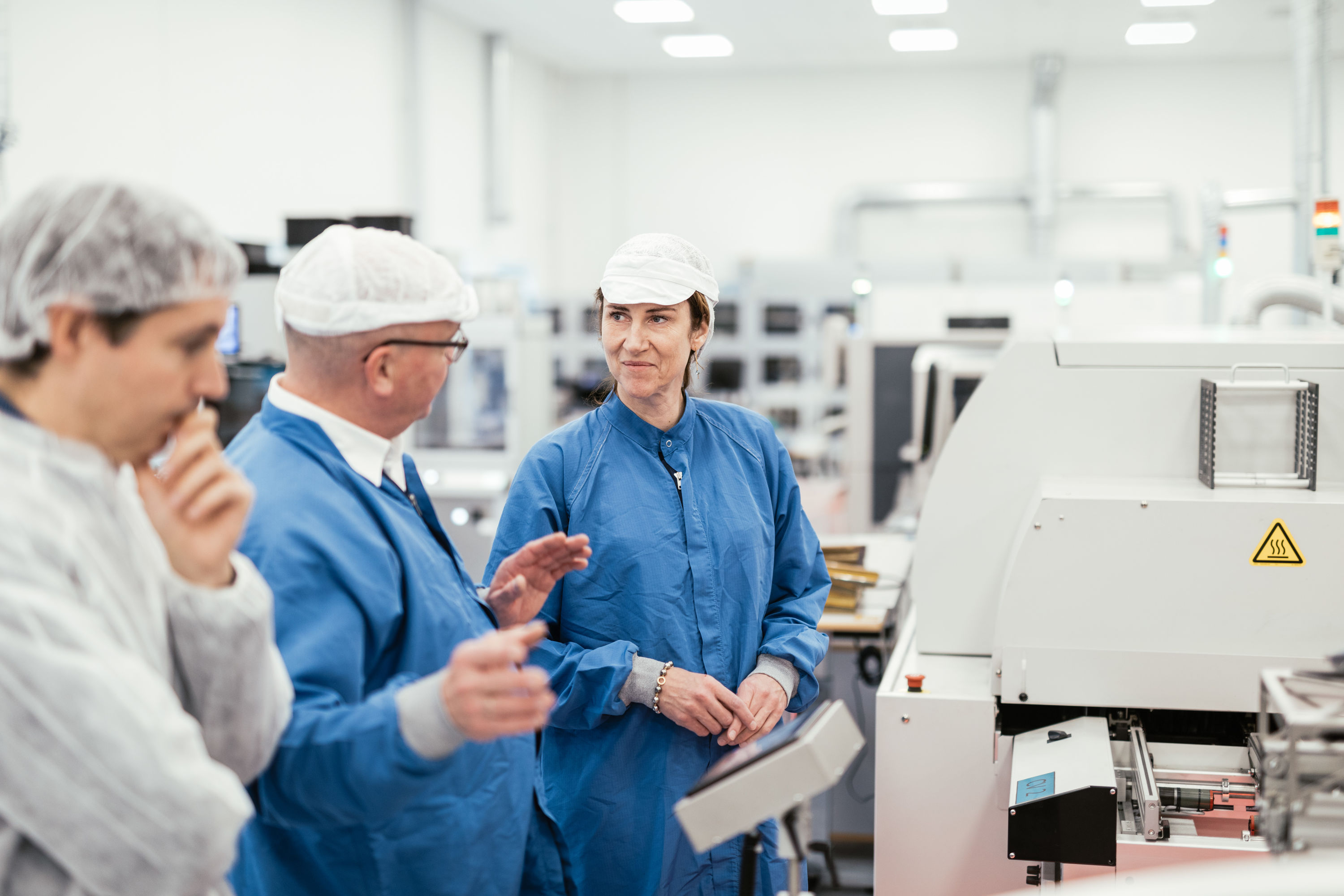 Morten Andersen, VP, Component Manufacturing, explains to Gitte Aabo, CEO, GN Hearing, the processes involved in manufacturing hearing aid chips and plastics at GN Hearing's facility in Præstø