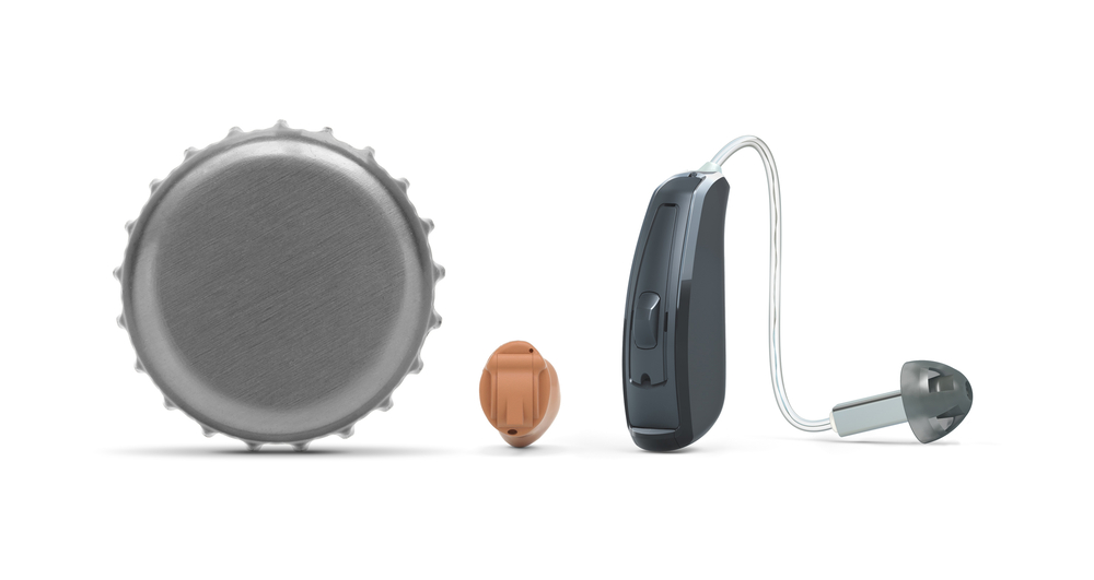 A ReSound custom hearing aid and ReSound LiNX 3D are smaller than a bottlecap